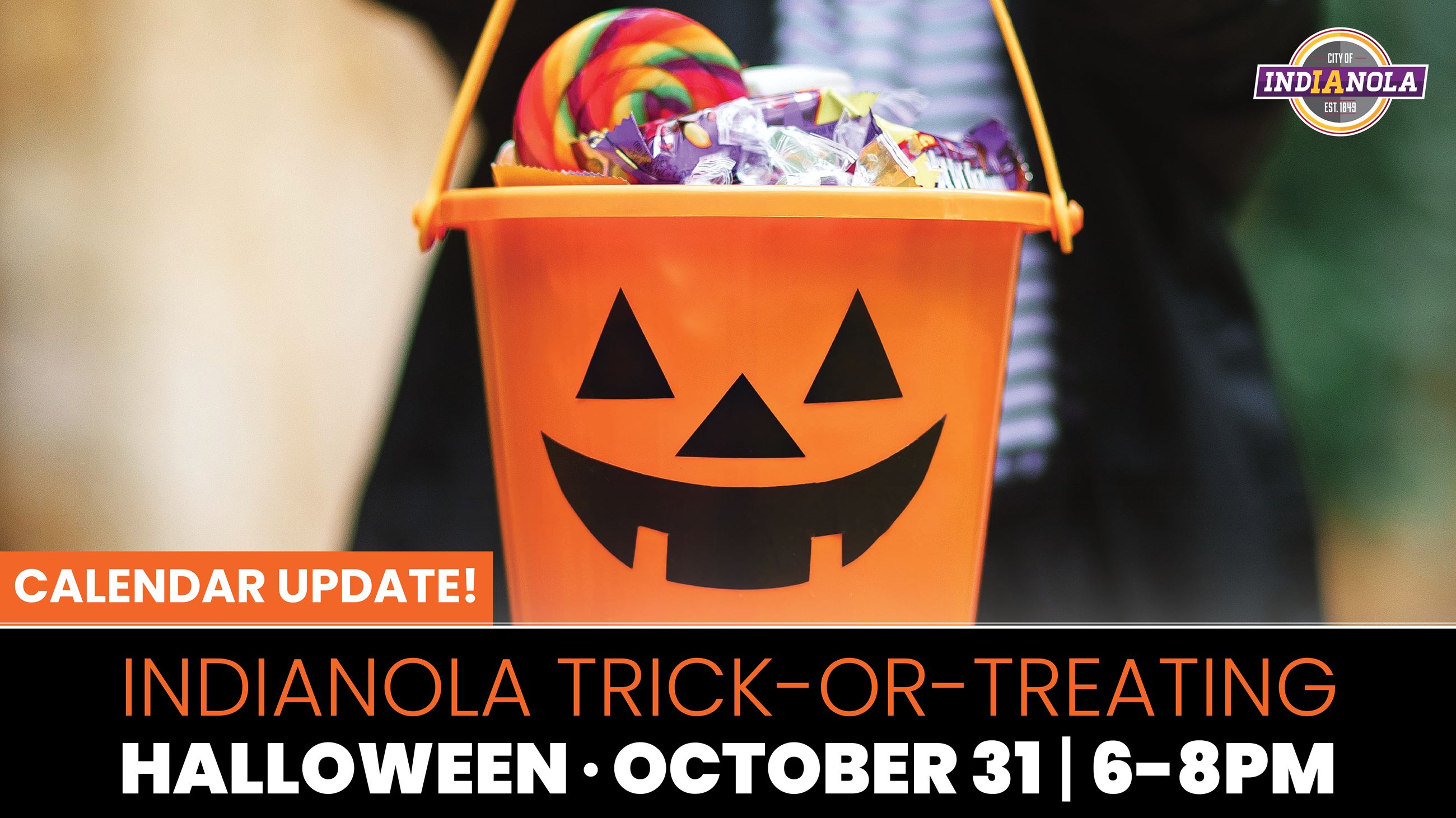 An orange pumpkin bucket promoting trick-or-treating in Indianola on Halloween, October 31.