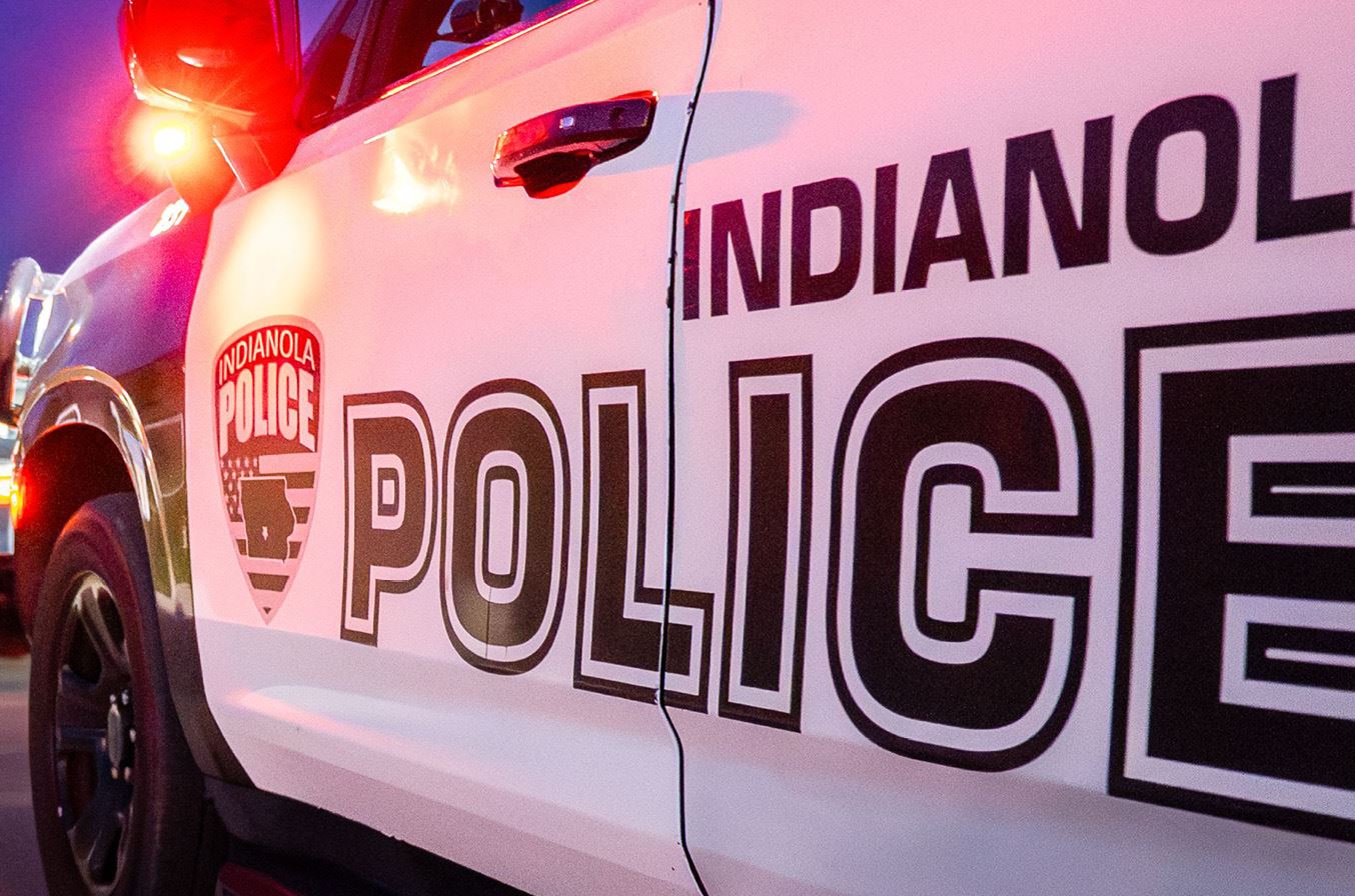 An Indianola Police vehicle is parked on a street after pulling over a motorist.