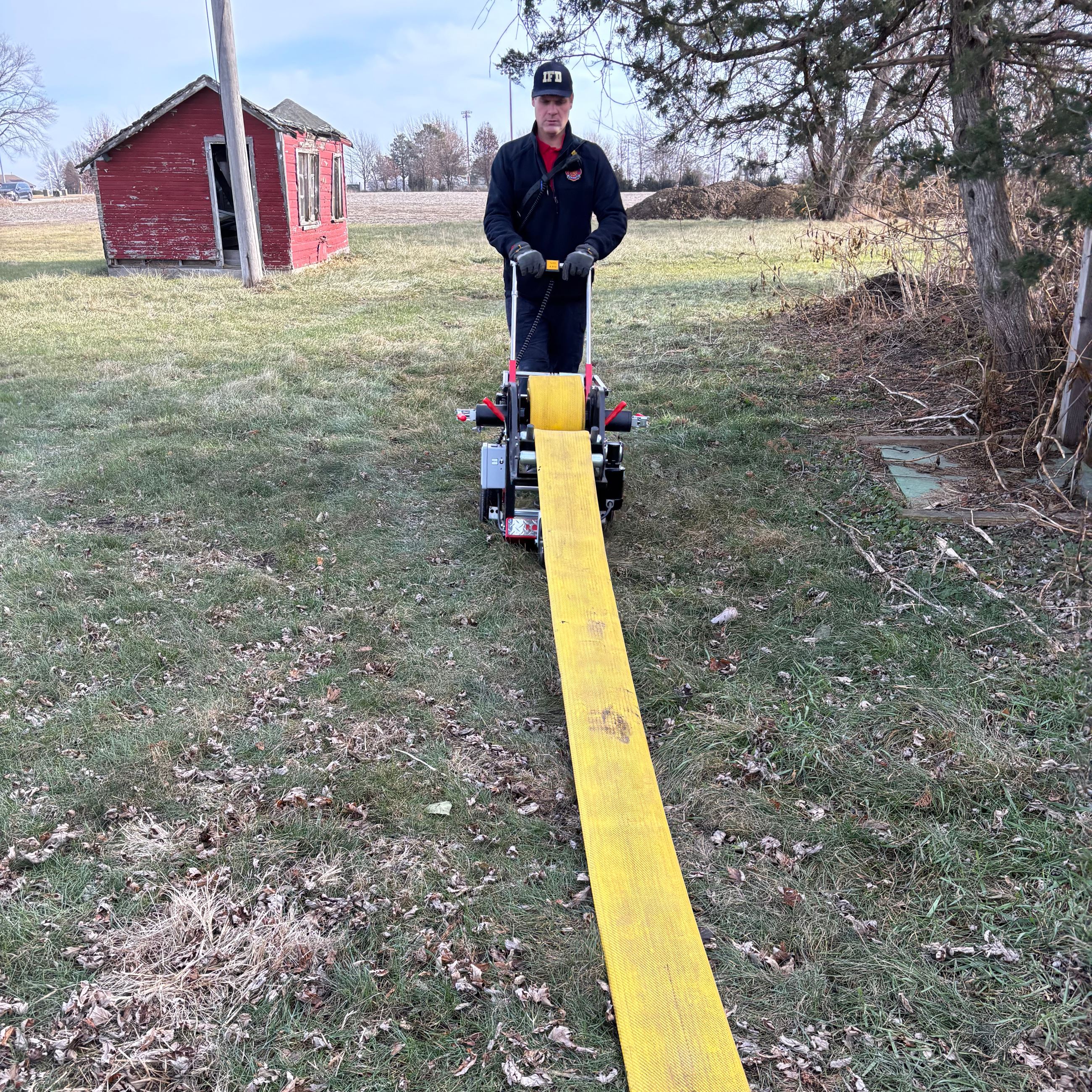 Indianola Fire Chief Aaron Hurt using the ROLLNRACK Power Roller
